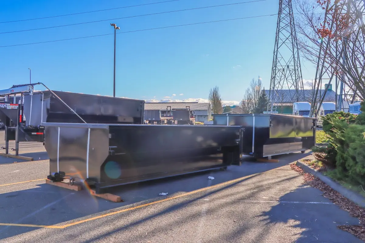 Roll-off dumpster ready for waste disposal at job site for 6 Yard Dumpster Rental in Lenoir City